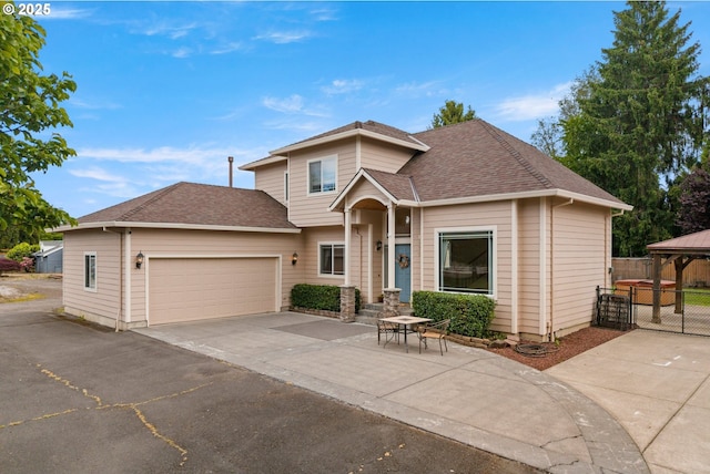 1670 NE Jackson School Rd, Hillsboro, OR 97124 - view of front of home with a gazebo, an attached garage, driveway, and a shingled roof