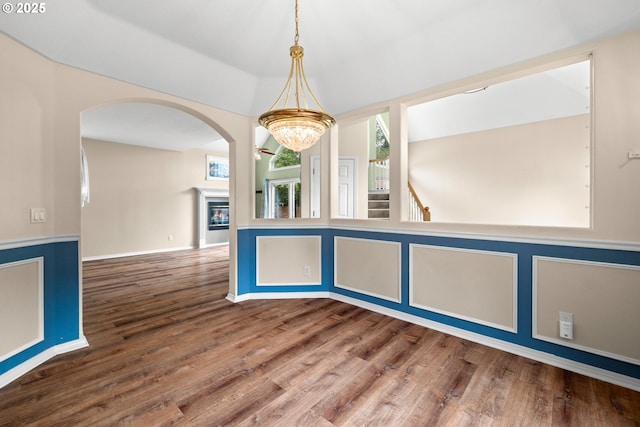 1670 NE Jackson School Rd, Hillsboro, OR 97124 - kitchen with wood finished floors, arched walkways, a chandelier, and decorative light fixtures
