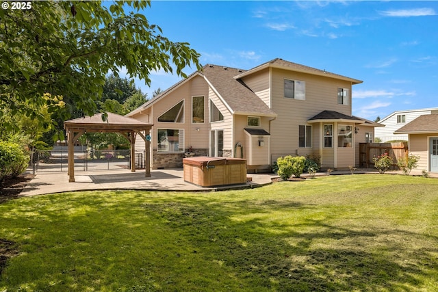 1670 NE Jackson School Rd, Hillsboro, OR 97124 - back of house featuring a hot tub, a gazebo, a patio area, and a shingled roof