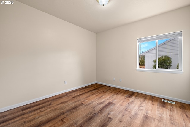 1670 NE Jackson School Rd, Hillsboro, OR 97124 - unfurnished room featuring wood finished floors and baseboards