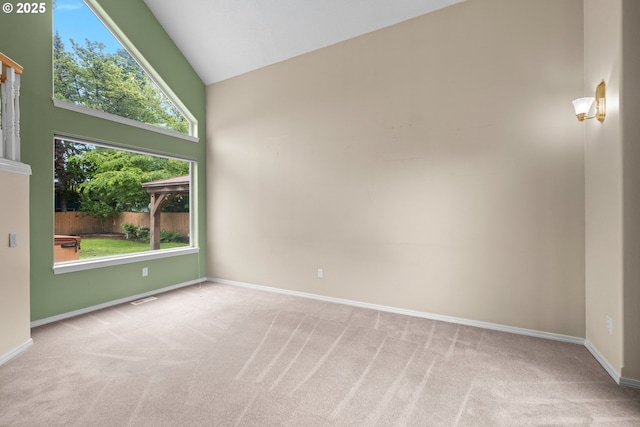 1670 NE Jackson School Rd, Hillsboro, OR 97124 - spare room featuring carpet, baseboards, and high vaulted ceiling