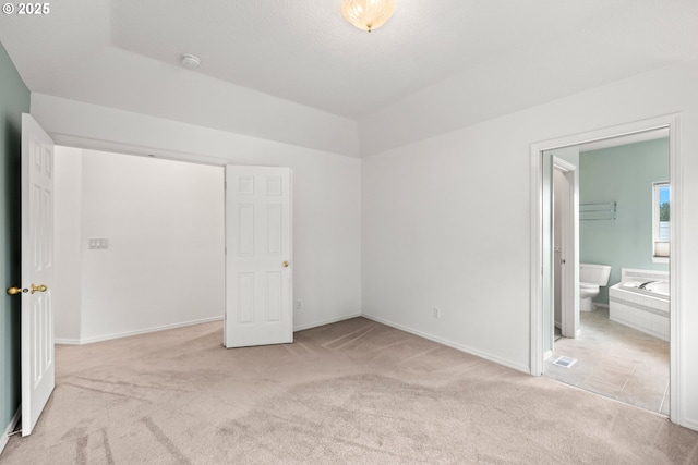 1670 NE Jackson School Rd, Hillsboro, OR 97124 - unfurnished bedroom featuring carpet flooring, baseboards, and connected bathroom