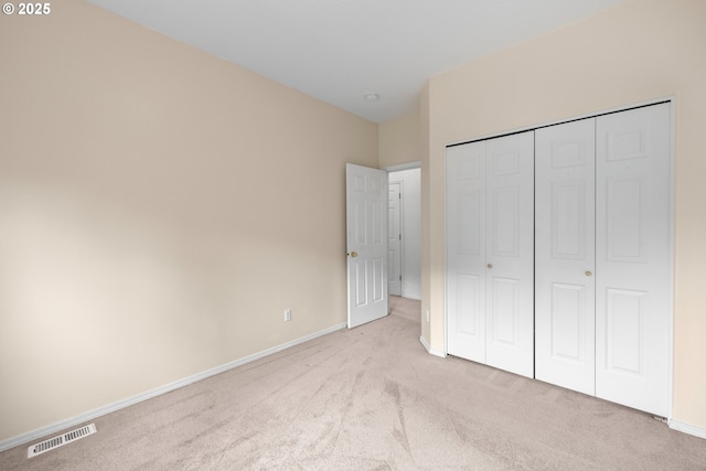 1670 NE Jackson School Rd, Hillsboro, OR 97124 - unfurnished bedroom featuring carpet, baseboards, and a closet