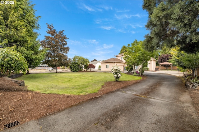 1670 NE Jackson School Rd, Hillsboro, OR 97124 - obstructed view of property with a front yard