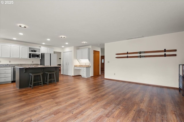 817 NW 141st St, Vancouver, WA 98685 - unfurnished living room with wood finished floors and recessed lighting