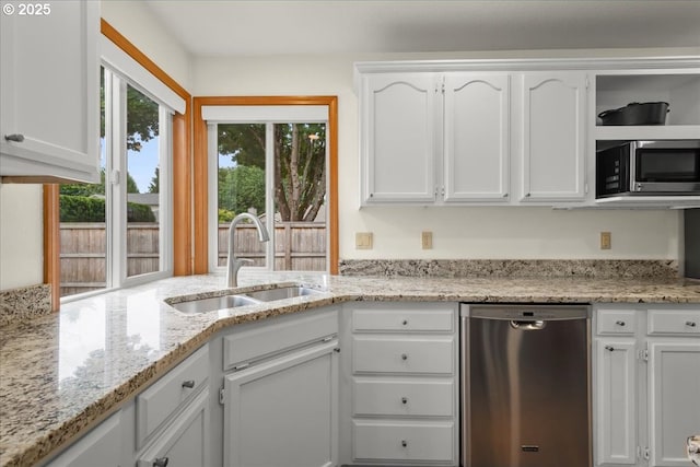 817 NW 141st St, Vancouver, WA 98685 - kitchen featuring appliances with stainless steel finishes, white cabinetry, and light stone counters