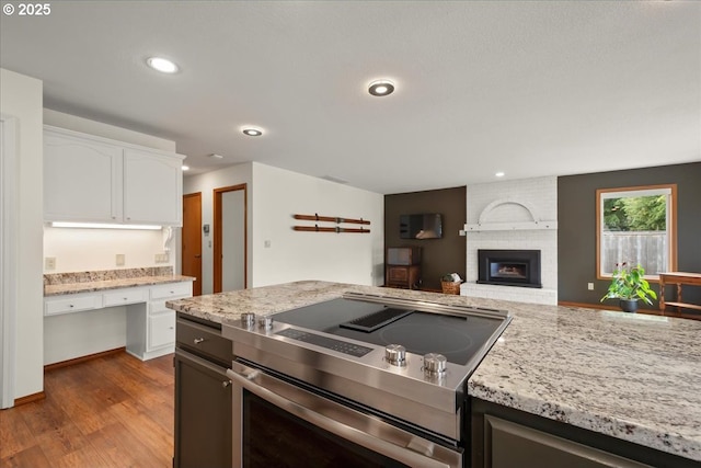 817 NW 141st St, Vancouver, WA 98685 - kitchen with stainless steel electric range, open floor plan, white cabinets, dark wood-style floors, and recessed lighting