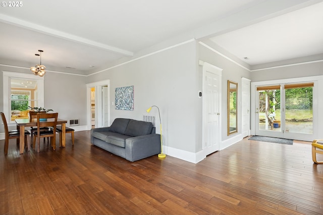 1006 4th Ave, Mosier, OR 97040 - living area with plenty of natural light, dark wood-style flooring, a chandelier, and baseboards