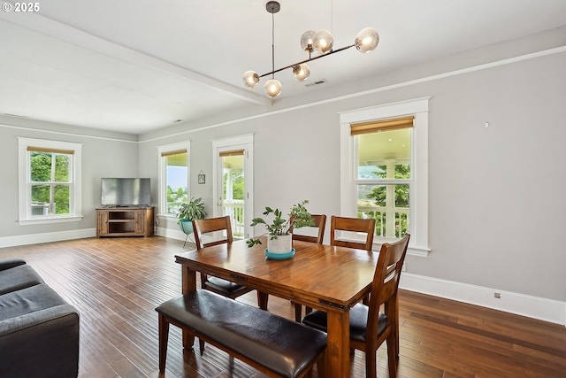 1006 4th Ave, Mosier, OR 97040 - dining space with baseboards, a chandelier, and hardwood / wood-style flooring