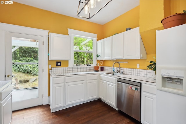 1006 4th Ave, Mosier, OR 97040 - kitchen with stainless steel dishwasher, white refrigerator with ice dispenser, a sink, white cabinets, and dark wood-type flooring