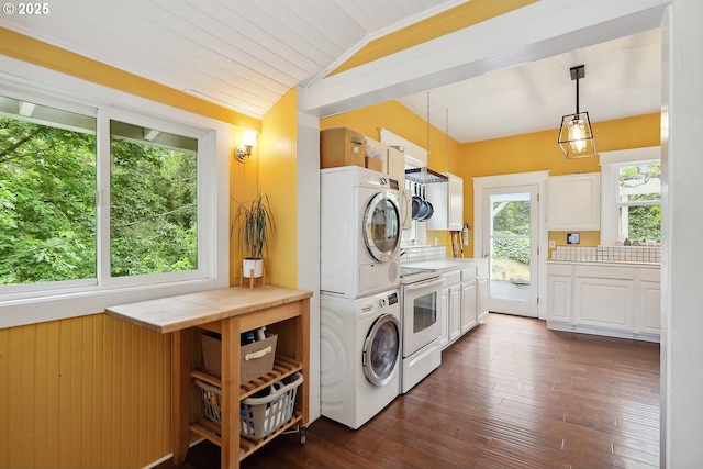 1006 4th Ave, Mosier, OR 97040 - laundry area featuring stacked washing machine and dryer and dark wood-style floors