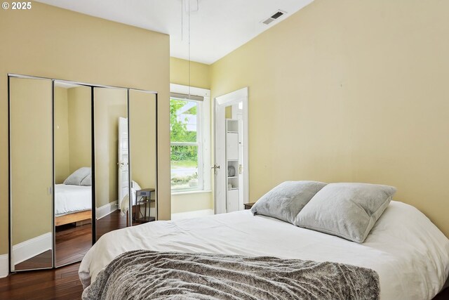 1006 4th Ave, Mosier, OR 97040 - bedroom featuring a closet, dark wood finished floors, and baseboards