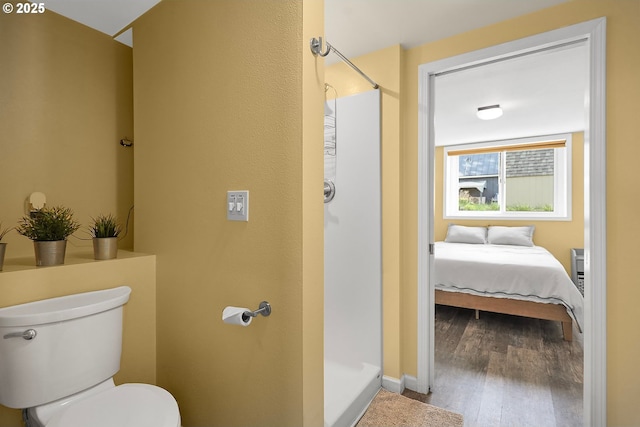 1006 4th Ave, Mosier, OR 97040 - full bath featuring a stall shower, wood finished floors, and toilet