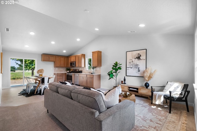 living room with sink and vaulted ceiling