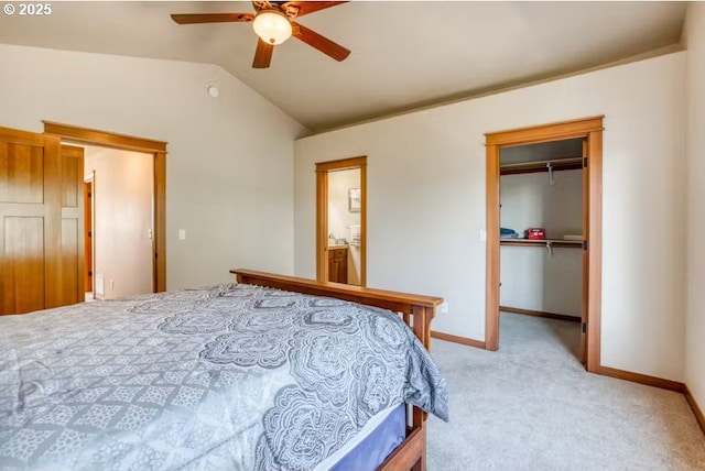 bedroom with light carpet, vaulted ceiling, a closet, and ceiling fan