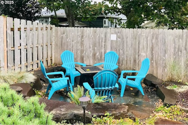 view of patio with a fire pit