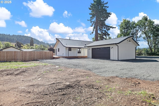 exterior space with a mountain view and a garage