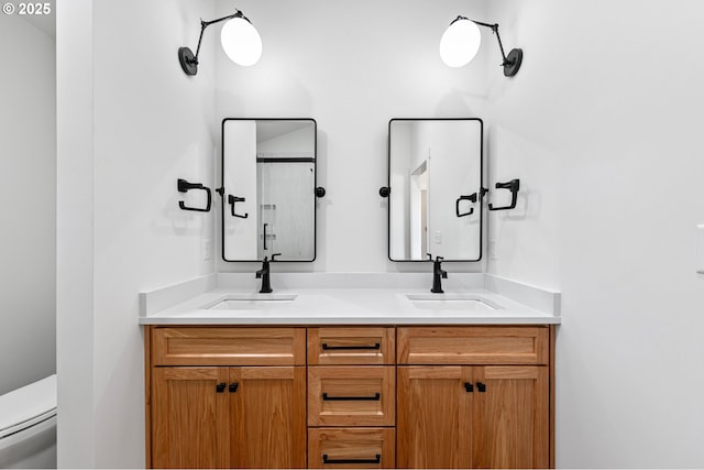 bathroom with toilet and vanity