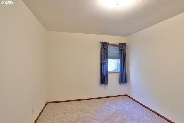 empty room featuring carpet floors