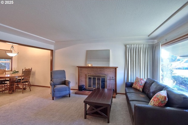 carpeted living room featuring a textured ceiling and a brick fireplace