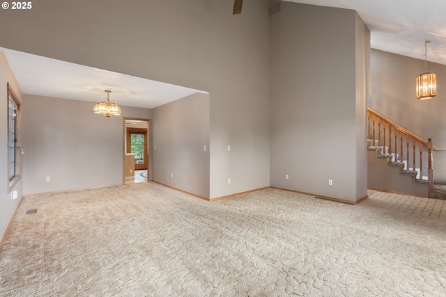 1705 SW 24th Dr, Gresham, OR 97080 - spare room featuring a chandelier, carpet floors, a high ceiling, and stairway