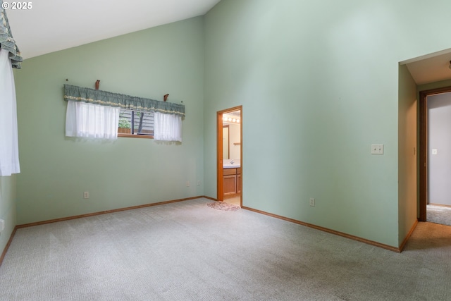 1705 SW 24th Dr, Gresham, OR 97080 - unfurnished room featuring carpet floors, high vaulted ceiling, and baseboards