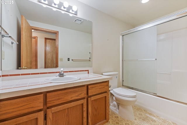 1705 SW 24th Dr, Gresham, OR 97080 - bathroom featuring vanity, toilet, bath / shower combo with glass door, tile patterned floors, and tasteful backsplash