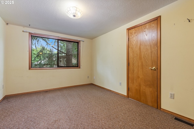 1705 SW 24th Dr, Gresham, OR 97080 - spare room featuring carpet flooring, a textured ceiling, and baseboards