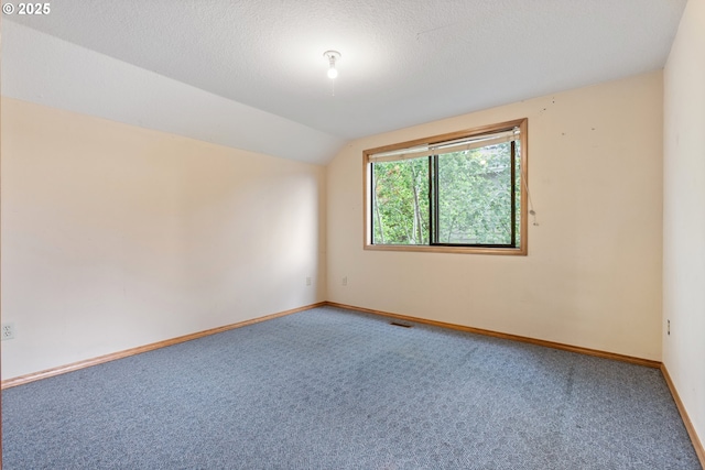 1705 SW 24th Dr, Gresham, OR 97080 - carpeted empty room with vaulted ceiling and baseboards