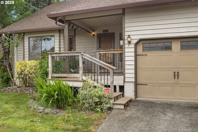 1705 SW 24th Dr, Gresham, OR 97080 - property entrance with a shingled roof, a garage, and driveway