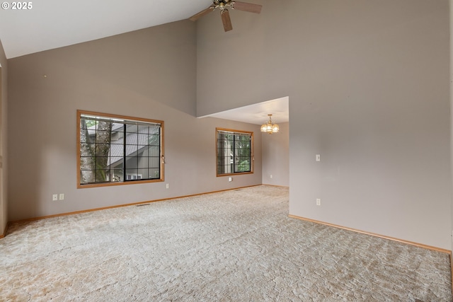1705 SW 24th Dr, Gresham, OR 97080 - carpeted spare room featuring high vaulted ceiling, baseboards, a chandelier, and ceiling fan