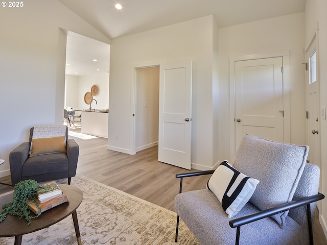 521 Kakela Rd, Winlock, WA 98596 - sitting room featuring light wood-style flooring, baseboards, recessed lighting, and lofted ceiling