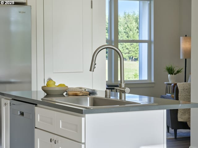 521 Kakela Rd, Winlock, WA 98596 - kitchen featuring a sink, white cabinetry, and stainless steel appliances