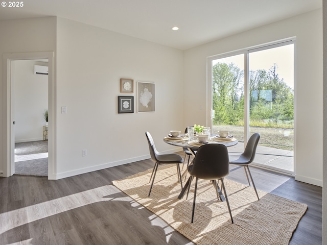 521 Kakela Rd, Winlock, WA 98596 - dining space with a wall mounted AC, recessed lighting, baseboards, and wood finished floors