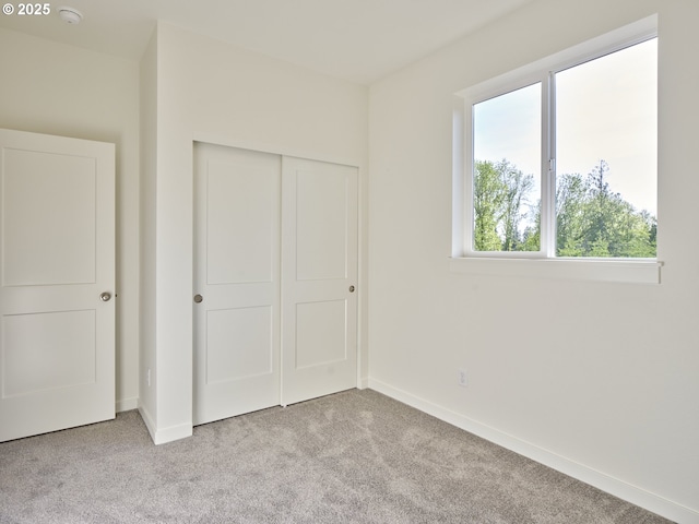 521 Kakela Rd, Winlock, WA 98596 - unfurnished bedroom with carpet flooring, a closet, and baseboards