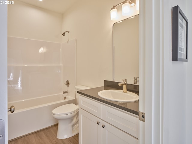 521 Kakela Rd, Winlock, WA 98596 - bathroom with vanity, wood finished floors, shower / bath combination, and toilet