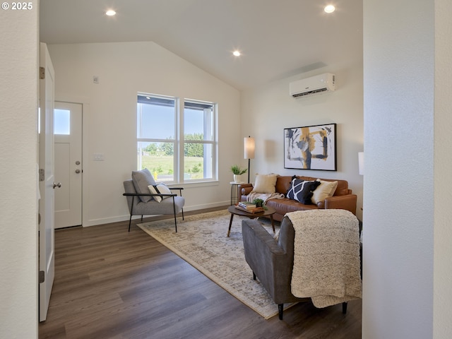 521 Kakela Rd, Winlock, WA 98596 - living room with a wall mounted air conditioner, dark wood-style floors, lofted ceiling, recessed lighting, and baseboards