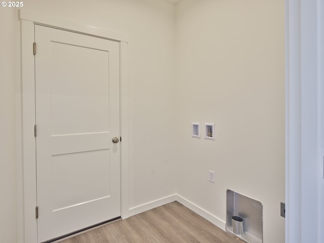 521 Kakela Rd, Winlock, WA 98596 - laundry room with light wood finished floors, hookup for a washing machine, and baseboards