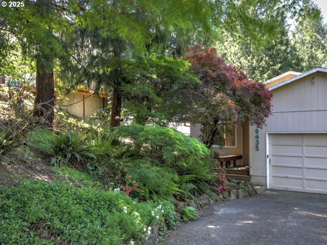 9435 SW 53rd Ave, Portland, OR 97219 - view of property exterior with an attached garage and driveway
