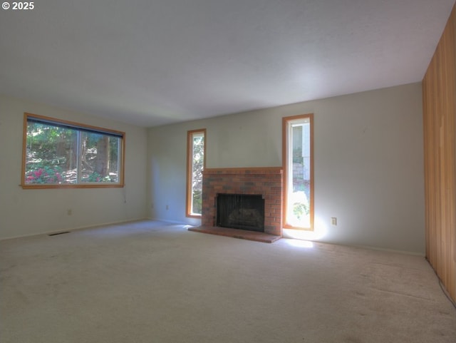 9435 SW 53rd Ave, Portland, OR 97219 - unfurnished living room with carpet, a fireplace, and baseboards