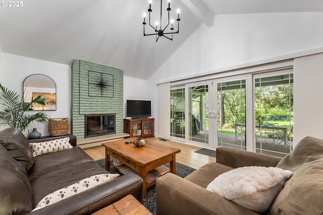living room with beam ceiling, a brick fireplace, high vaulted ceiling, a chandelier, and wood finished floors
