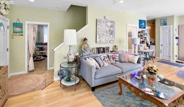 living room with wood finished floors, recessed lighting, and baseboards