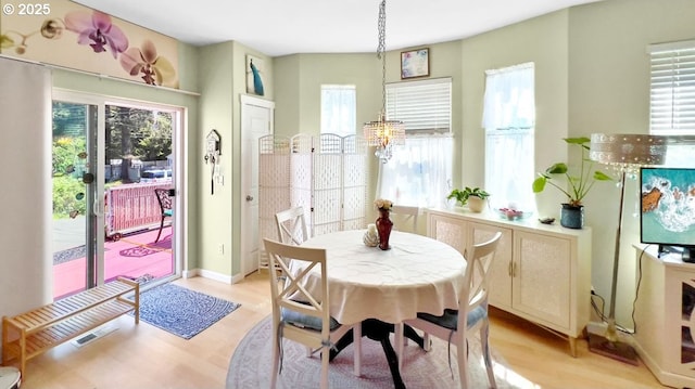 dining area with light wood-style flooring