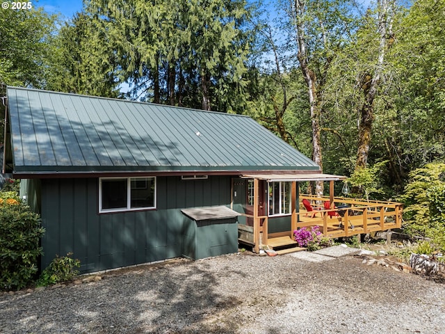 25050 Wilson River Hwy, Tillamook, OR 97141 - chalet / cabin featuring a standing seam roof, metal roof, and a wooden deck