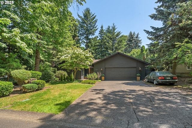 16523 NE Fargo Cir, Portland, OR 97230 - view of front of home featuring an attached garage, driveway, and a front lawn