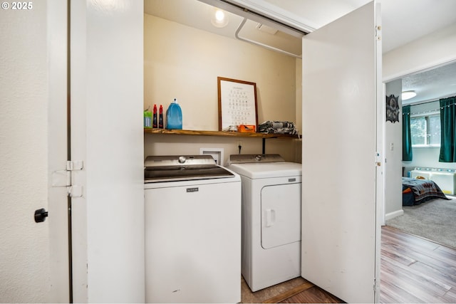 16523 NE Fargo Cir, Portland, OR 97230 - laundry room with washer and dryer and light wood-type flooring