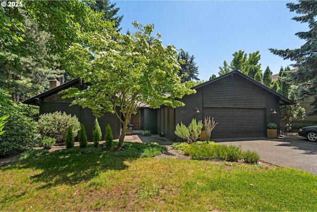 16523 NE Fargo Cir, Portland, OR 97230 - view of front of home with driveway, a front yard, and a garage