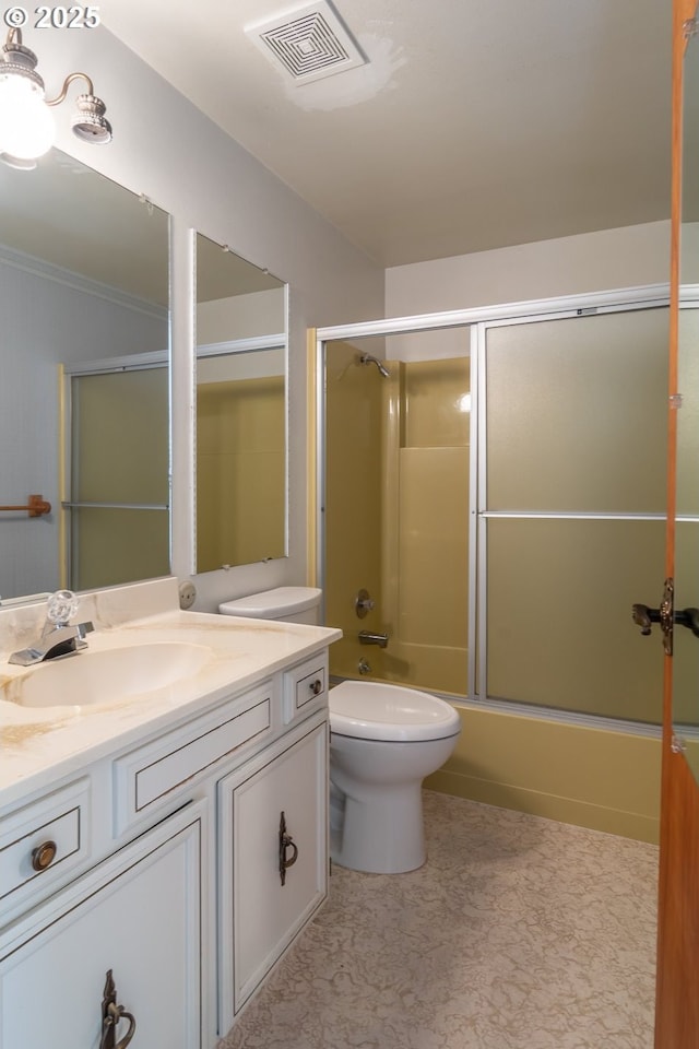 bathroom with toilet, visible vents, bath / shower combo with glass door, and vanity