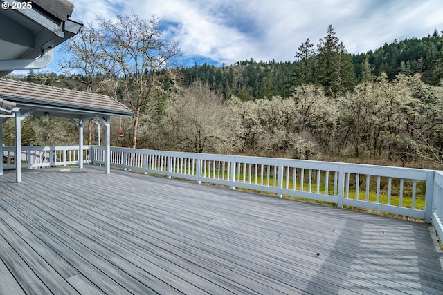 deck featuring a wooded view