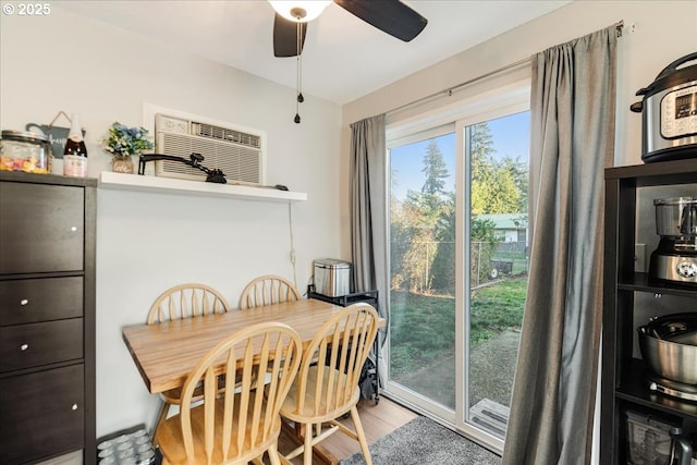 dining space featuring hardwood / wood-style flooring and ceiling fan